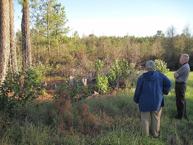 reubinthompson_org_146.jpg - This is Mr. and Mrs. Bill Mixon, who own the land where the Polly Kersey Cemetery is located. Mr. Mixon is looking for persons or a group to assume maintenance and upkeep of the cemetery since his age precludes him from doing it any longer. The cemetery needs the brush cleared and a fence installed to help protect it. This cemetery contains the graves of brothers Francis Richard Flanders and Thomas Flanders who were killed by Creek Indians during an Indian uprising in 1802. The Kersey family discoved the bodies of the Flanders brothers and buried them in the Polly Kersey Cemetery.