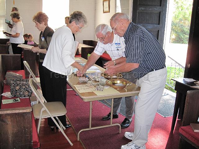 reubinthompson_org_18.jpg - Bo George and Carl Roghella counting the donations.