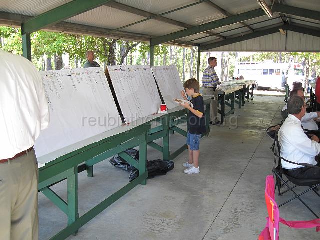 reubinthompson_org_38.jpg - A young man studying about his ancestors on the Reubin Thompson four generation decendency chart.